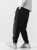 Embroidered Solid Color Ankle Banded Pants