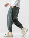 Embroidered Solid Color Ankle Banded Pants